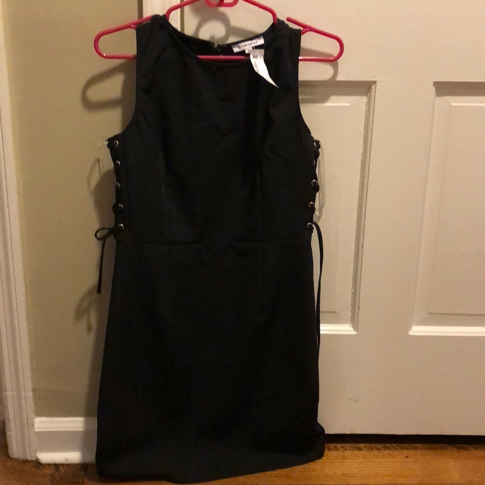 Black sleeveless dress with lace up sides